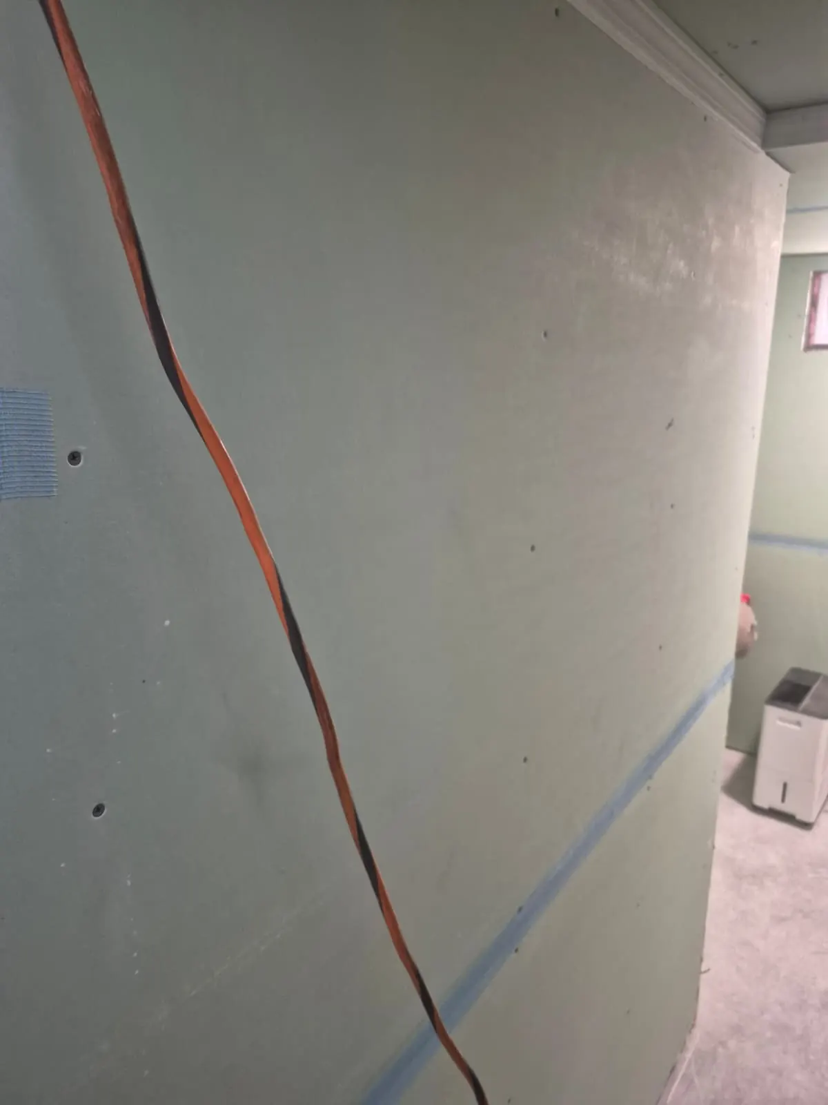 Finished wall and trim detail through a stairwell