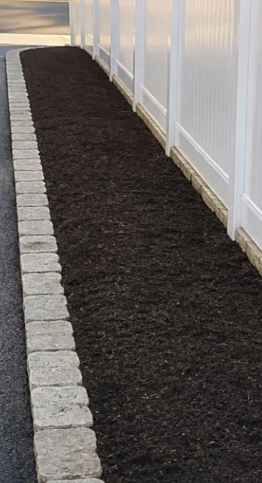 Finished fence-line planting bed